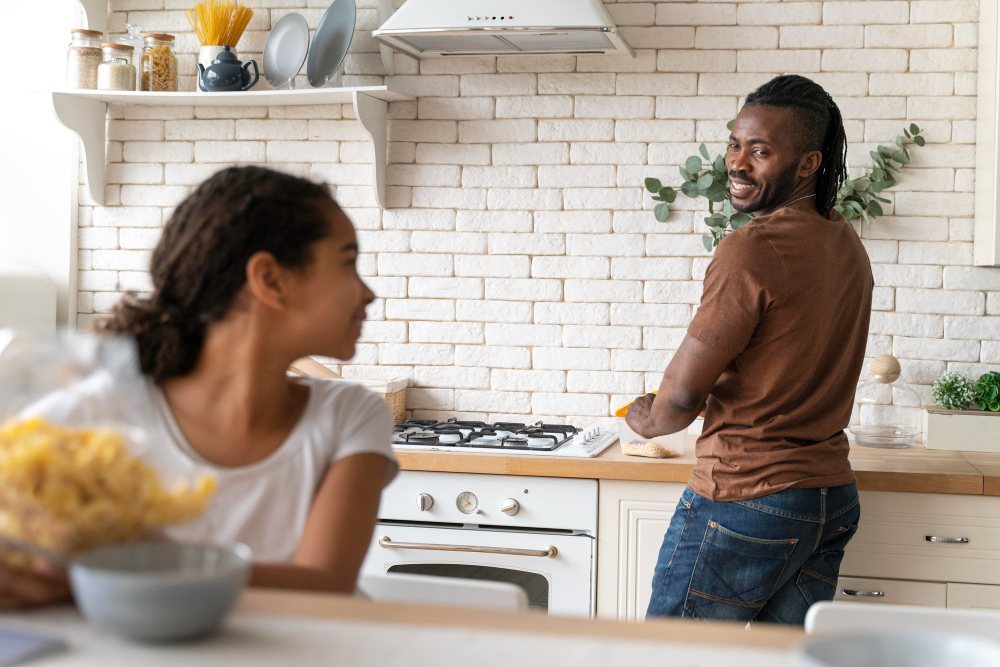 Family cooking with gas in a modern kitchen